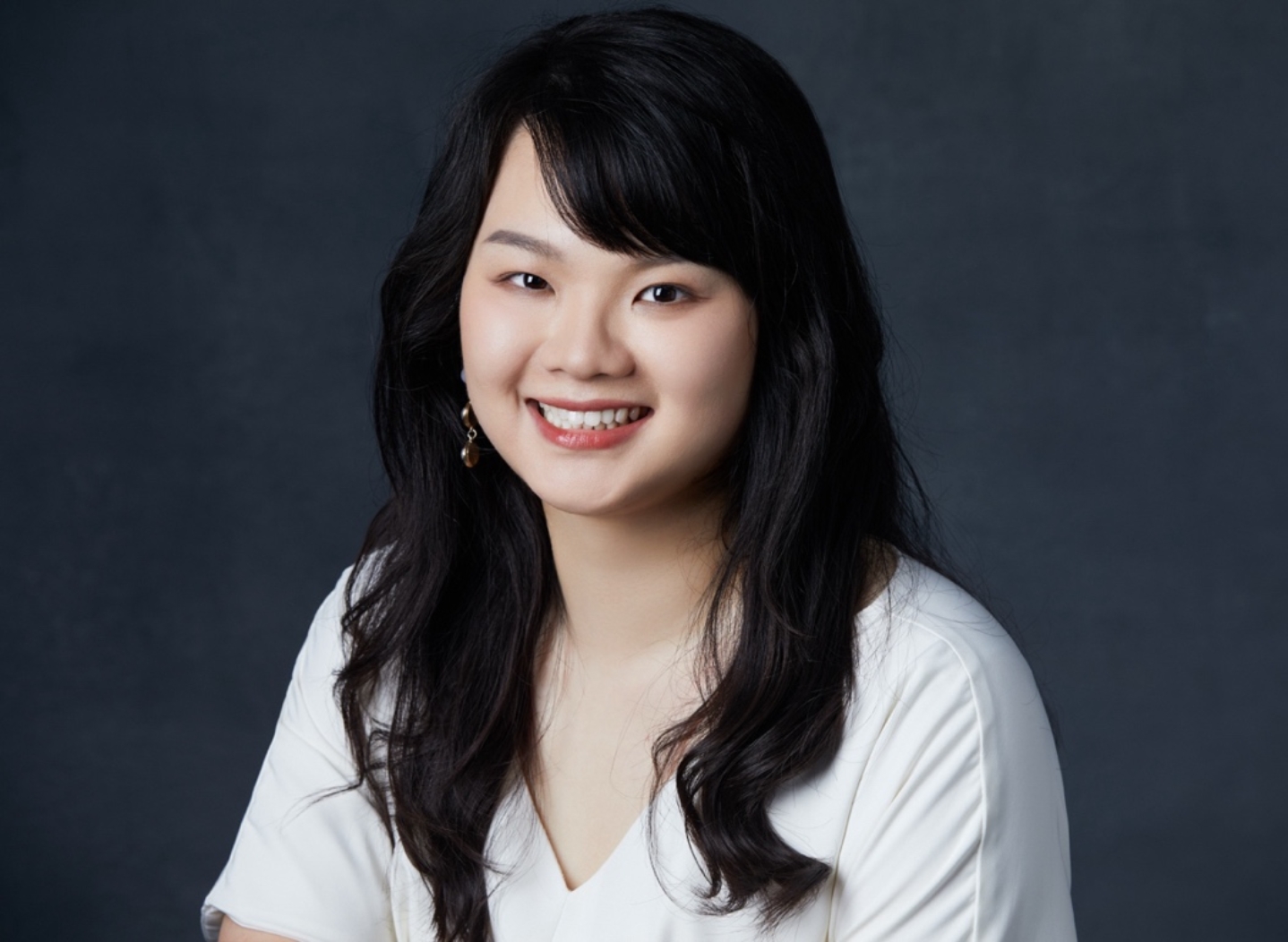 A person with long black hair smiling

AI-generated content may be incorrect.